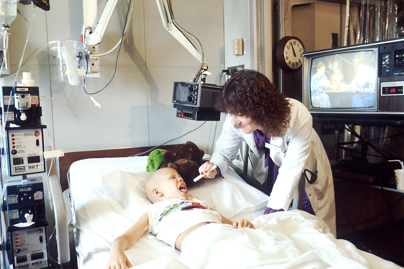 A doctor and child during a pediatric oncology appointment