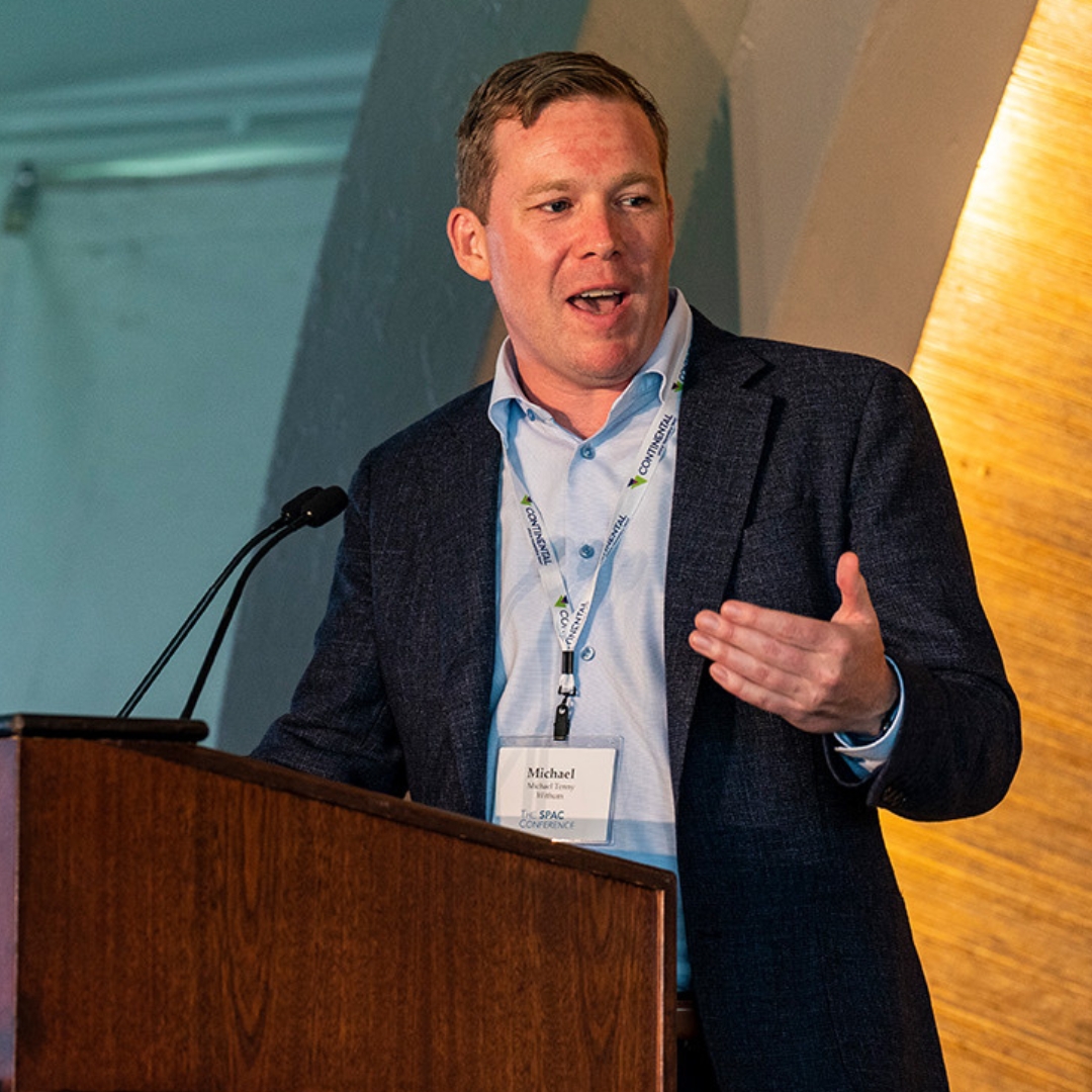 SPAC Conference speaker presenting at a podium